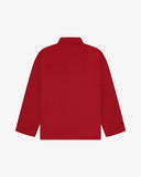 Back view of berry red, buttoned organic cotton overshirt with view of reinforced elbow area and boxy silhouette.