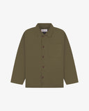 Front flat shot of dark taupe, buttoned organic cotton overshirt. Clear view of chest and hip pockets, corozo buttons and Uskees branding label.