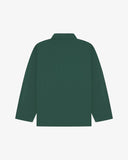 Back view of green, buttoned organic cotton overshirt with view of reinforced elbow area and boxy silhouette.