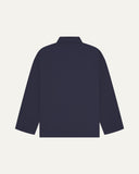Back view of midnight blue, buttoned organic cotton overshirt with view of reinforced elbow area and boxy silhouette.
