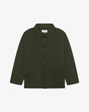 Front flat shot of vine green, buttoned drill overshirt. Clear view of corozo buttons, 3 pockets and Uskees branding label.