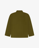Reverse of woodland green buttoned organic cotton corduroy overshirt from Uskees. Showing reinforced elbows and boxy silhouette.