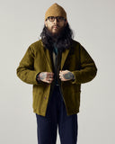 Modelling the 3001 Uskees button-down corduroy overshirt in woodland green layered with various Uskees apparel.