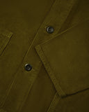 The 3001 Uskees button-down corduroy overshirt in woodland green, with focus on the cuff, hip pockets and corozo buttons.