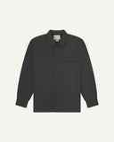 Charcoal buttoned organic cotton overshirt from Uskees with clear view of chest pocket and Uskees branding label.