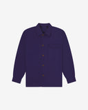Deep indigo buttoned organic cotton workshirt from Uskees with clear view of chest pocket and utilitarian silhouette.