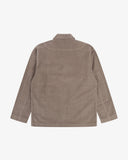 Reverse of beech (pale brown) buttoned organic corduroy blazer from Uskees showing reinforced elbows and boxy silhouette.