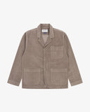 Full front view of beech (pale brown) buttoned organic corduroy blazer from Uskees with notch lapels, a three-button front closure, three patch pockets and Uskees branding label.