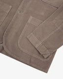 Closer detail view of hip patch pocket, hemline and the extra durable weave of the organic cotton beech (pale brown) corduroy fabric.
