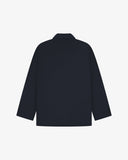 Reverse of dark blue (blueberry) buttoned organic cotton-drill blazer from Uskees showing reinforced elbows and boxy silhouette.