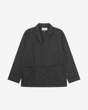 Full front view of charcoal-grey buttoned organic cotton-twill blazer with clear view of three patch pockets and Uskees branding label.