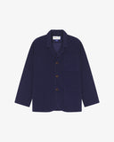 Flat front view of men's corduroy deep indigo blazer with 3 patch pockets from Uskees. Clearly showing corozo buttons and 3 pockets on the front.