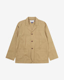 Full front view of khaki buttoned organic cotton-twill blazer with clear view of three patch pockets and Uskees branding label.