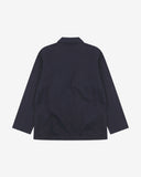 Reverse of deep blue buttoned organic cotton-twill blazer from Uskees showing reinforced elbows and boxy silhouette.