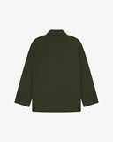 Reverse of vine green buttoned organic cotton-drill blazer from Uskees showing reinforced elbows and boxy silhouette.