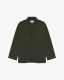 Vine green buttoned organic cotton-drill blazer from Uskees with clear view of three patch pockets and Uskees branding label.