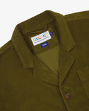 Close-up front view of organic cord woodland green blazer showing the collar, lapels and Uskees brand label.