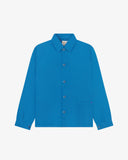 Flat front view of organic cotton opal-blue signal jacket from Uskees. Clearly showing the corozo button fastening and 2 deep hip pockets.