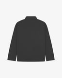 Back view of Uskees charcoal-grey drill field jacket showing the modern military silhouette.