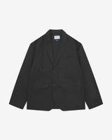 Full front view of organic cotton twill black docklands blazer. Clearly showing 2-button fastening, 3 jetted pockets and Uskees brand labels.