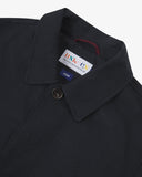 Uskees midnight blue men's car coat with focus on collar detail showing the Uskees brand label, hanging loop and corozo buttons.