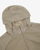 Close up shot of an Uskees zip up trekking jacket for men in light green showing the hood and zip detail.