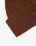 Close-up of the chestnut brown Donegal wool hat from Uskees, showing the ribbing, multicoloured speckled detail and texture of the natural Irish Merino wool.