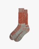 Flat view of Uskees 4006 alpine brown organic cotton sock, showing bands of orange, mint and white.