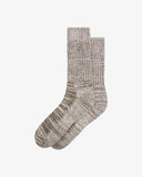 Flat view of Uskees 4006 willow green organic cotton fuzz sock, showing bands of green and white.