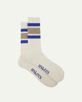 Flat view of a pair of Uskees 4011 khaki, organic cotton, college stripe socks, showing coloured bands and the Uskees branding at the base of each sock.