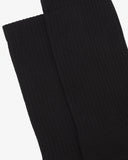 Focus on the rib of the black organic cotton blend  socks from Uskees.