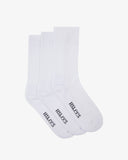 Three 4015 white socks with 'USKEES' branding in black on the sole.