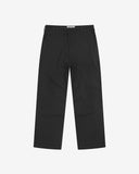 Full-length front view of Uskees twill workwear pants in black. Showing Corozo button fastening and tapered leg fit.