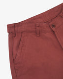 Close up of waist area of drill workwear pants in chestnut-brown. Clear view of front pocket, Corozo button fastening, and organic cotton drill weave.