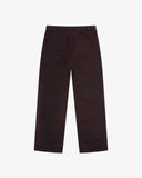 Back view of Uskees dark plum colour trousers with one buttoned back pocket  and one flap pocket on the back, shown flat against a light gray background.