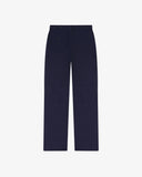 Full length back-view of deep indigo corduroy 5005 trousers with view of rear pockets, belt loops and flattering straight leg fit.