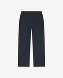 Back flat view of 5020 drill utility pants in blueberry. Indicating relaxed fit, two jetted pockets and length falling just above the ankle.