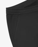 Close up view of the pocket of the charcoal grey drill pants from Uskees.