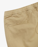 Close up view of the jetted back pocket and the waistband of the khaki ripstop pants from Uskees.