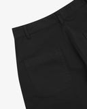 Close-up reverse view of Uskees black work pants with focus on left rear pocket, belt loops and cotton twill material.