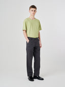 Full-length view modelling 5021 Uskees men's organic twill charcoal grey painter pants paired with Uskees t-shirt.