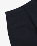 Close-up reverse view of Uskees midnight blue work pants with focus on left rear pocket, belt loops and cotton twill material.