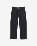 Full-length front view of raw orta denim workwear pants in dark indigo. Showing button fastening, zip, Uskees branding label and tapered leg fit.