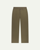 Front flat view of Uskees barrel leg pants in dark taupe. Showing Corozo button fastening, baggy fit with tapered cuff.