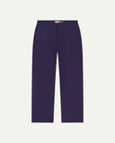 Front flat view of Uskees barrel leg pants in deep indigo. Showing Corozo button fastening, baggy fit with tapered cuff.