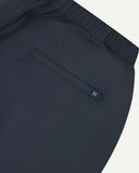 Close-up back view of blueberry 5024 men's ripstop utility shorts. Clear view of jetted back pocket, Uskees logo label and elasticated waistband.