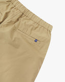 Close up back view of the jetted back pocket, elasticated waist and small Uskees tab label of the khaki ripstop shorts.