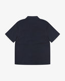 Back view flat shot of Uskees dark blue Cuban short sleeve shirt for men.