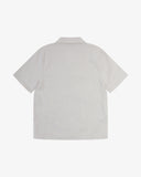 Back view flat shot of Uskees off-white Cuban shirt for men.