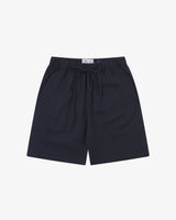 Front flat shot of Uskees dark blue shorts for men. Clear view of drawstring, elasticated waist and Uskees branding label.